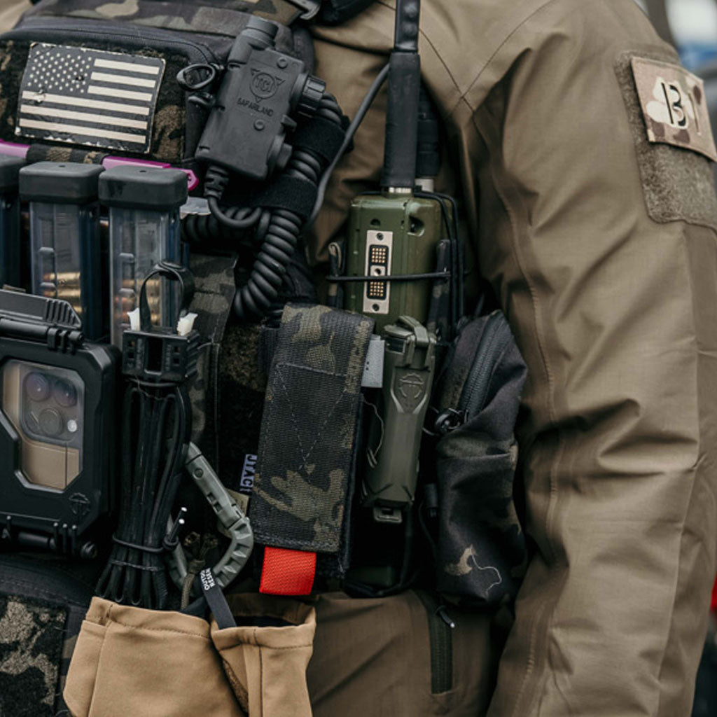 CellVault-18 mounted between tourniquet and radio on a chest rig.