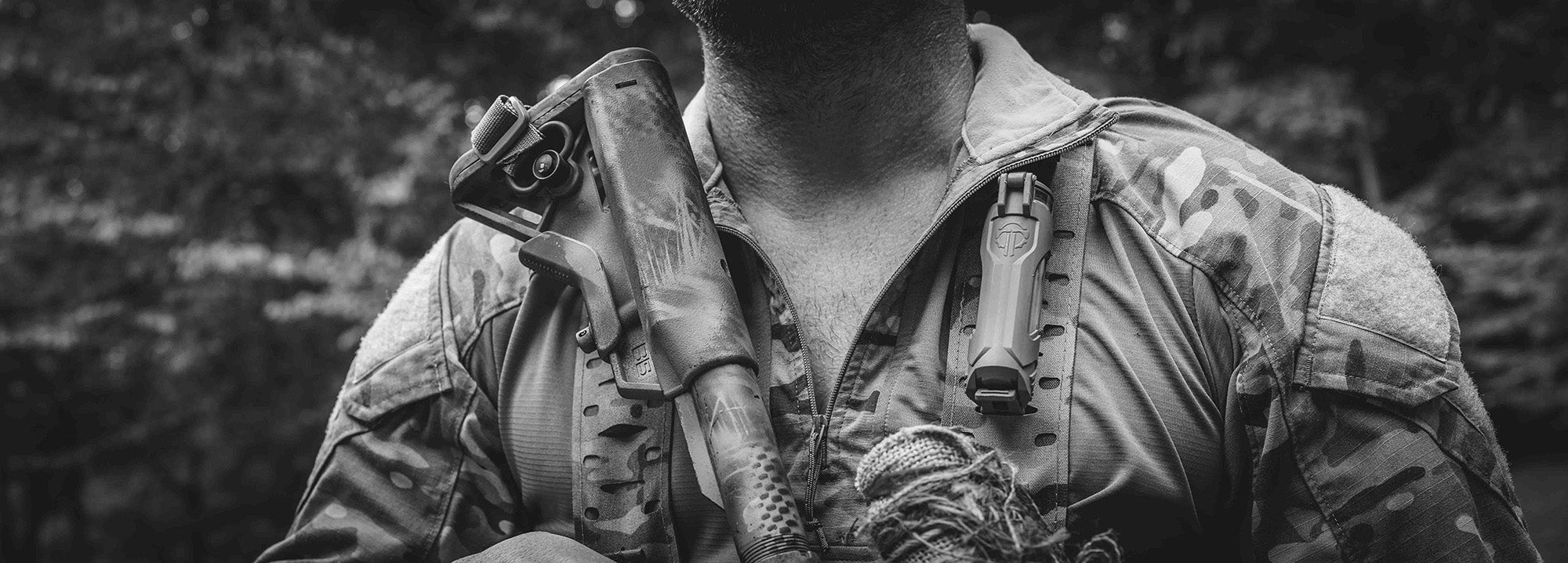 Man with a Thyrm CellVault-21 Battery Storage Case mounted to his chest rig