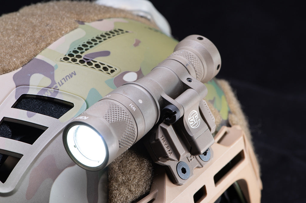 SureFire mounted to a Thyrm VariArc-M-LOK Light Mount, on a helmet.