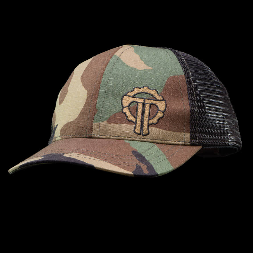 Camouflage trucker hat with embroidered Thyrm logo, mesh back, and curved brim, designed for tactical and wilderness use.