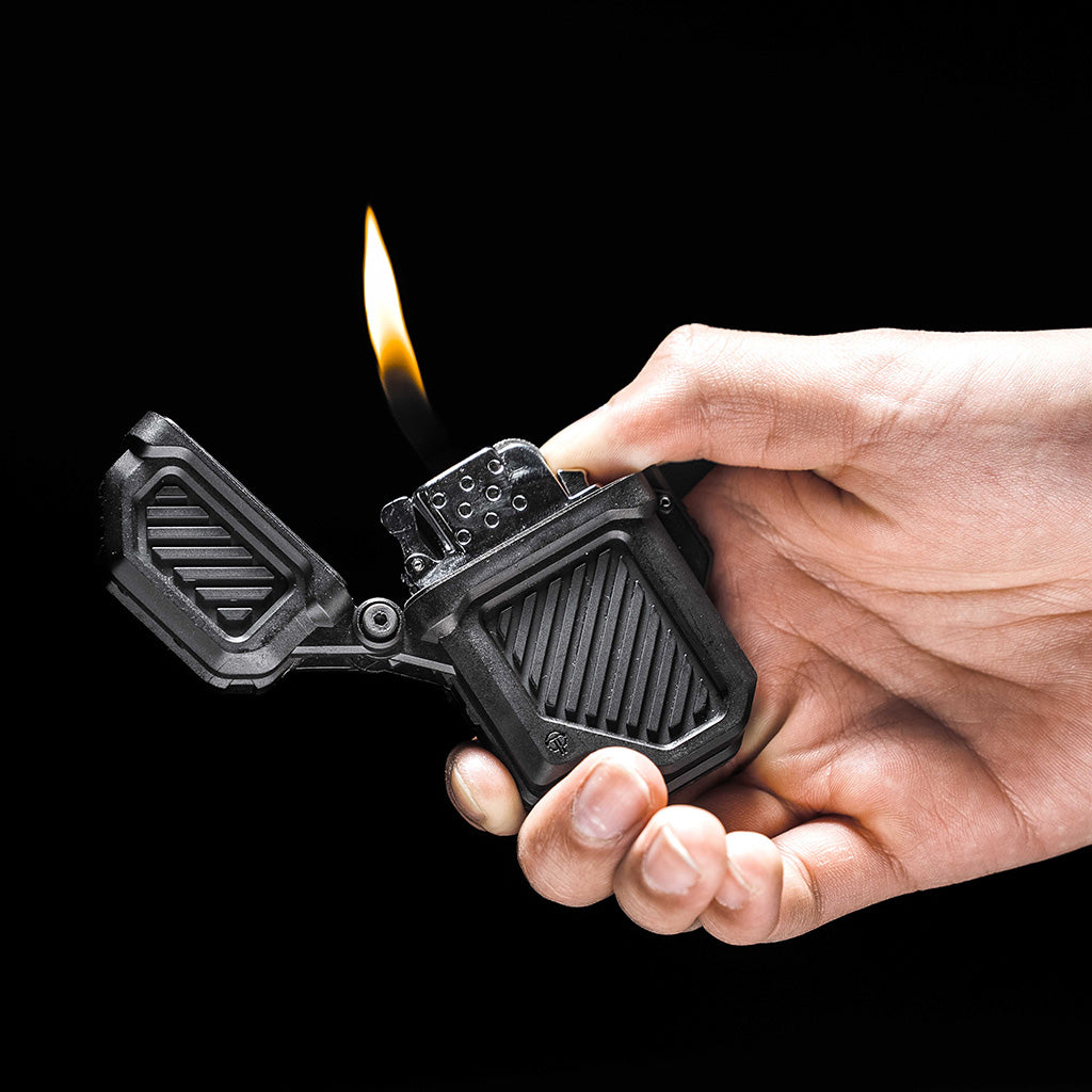 Durable PyroVault 2.0 Lighter Armor for Zippo and similar inserts, showcased in hand with flame ignited.