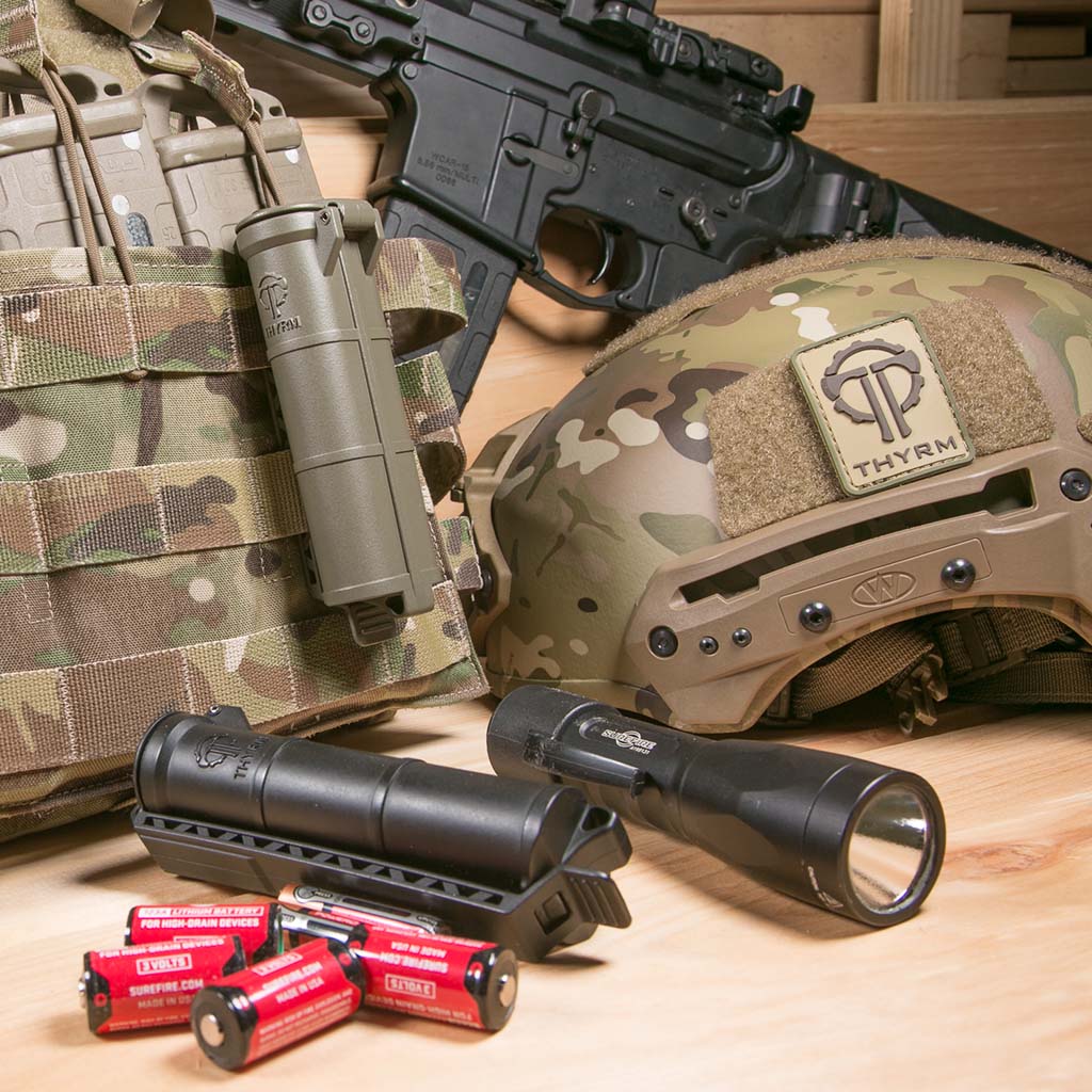 Two CellVault XLs amongst gear including MOLLE and batteries.