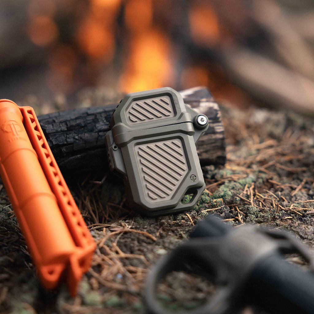 Thyrm PyroVault, CellVault and SwitchBack near a campfire