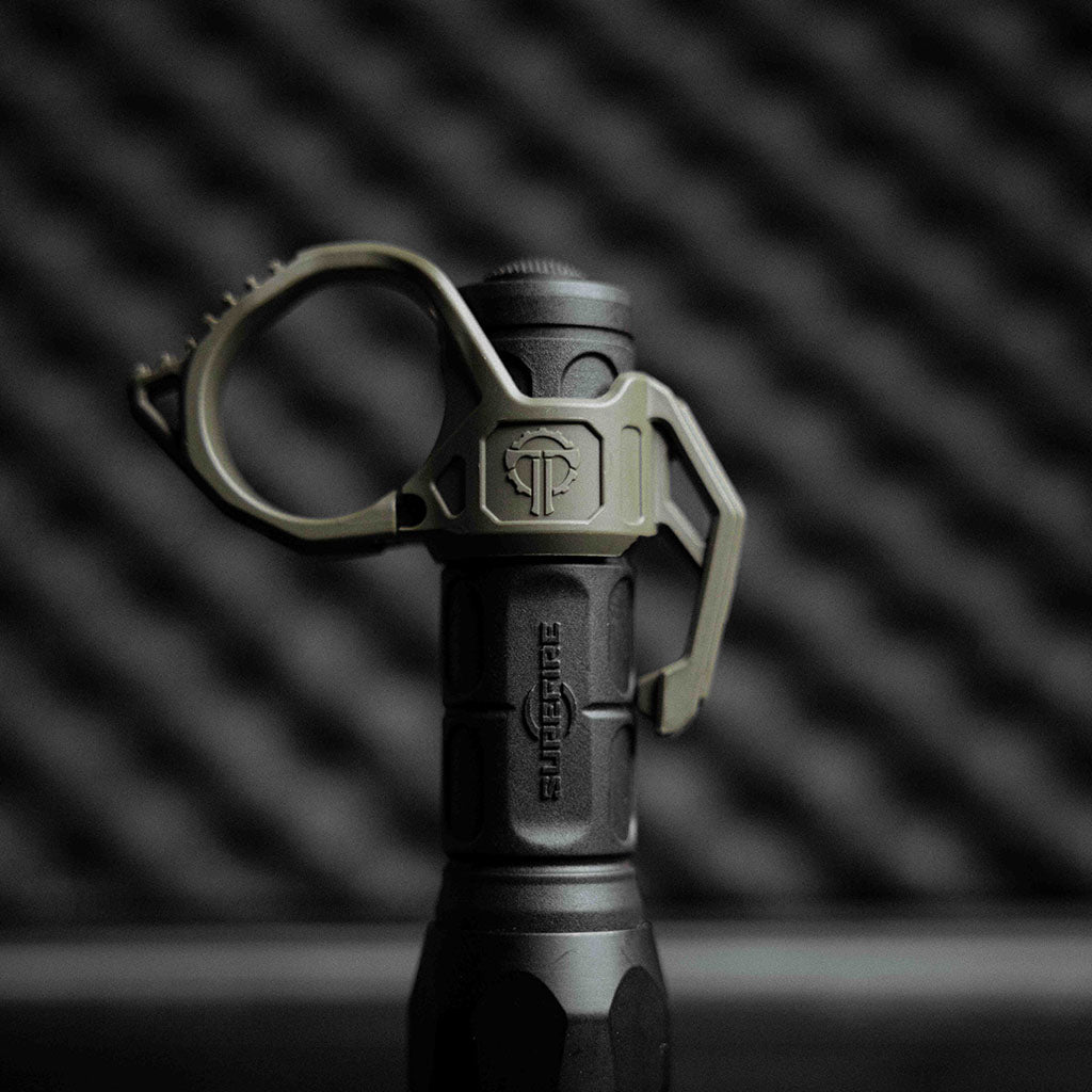 The SwitchBack 3.0 Duty Flashlight Ring on a SureFire light