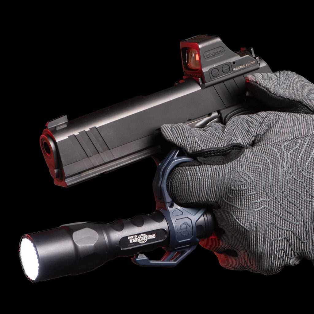 SwitchBack 3.0 Duty Flashlight Ring securely attaches a flashlight to a handgun for tactical use, featuring a pocket clip.