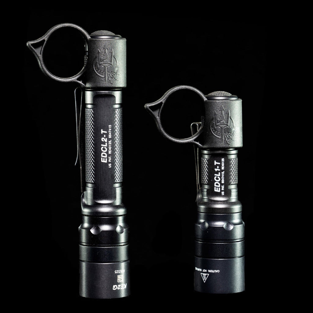 SwitchBack S SureFire EDC flashlight ring attached to two tactical flashlights, showcasing versatility and design.