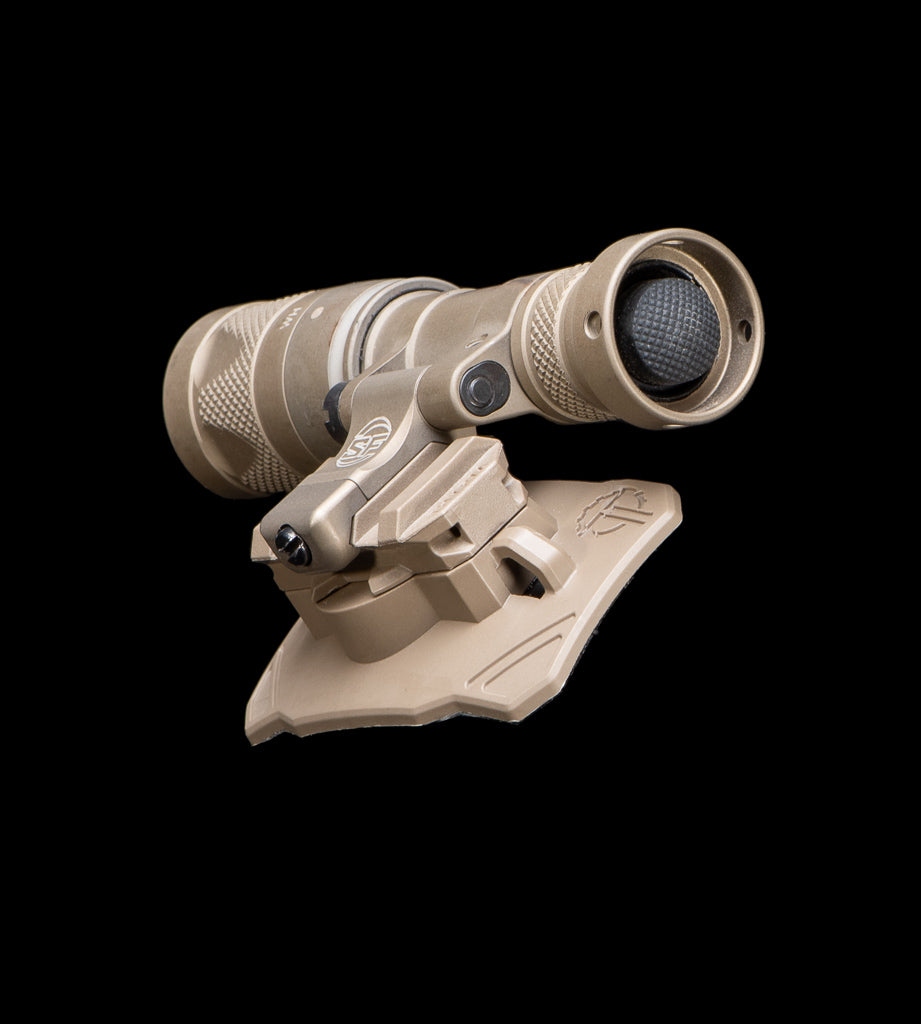 Tactical flashlight attached to a Thyrm VariArc with a black background