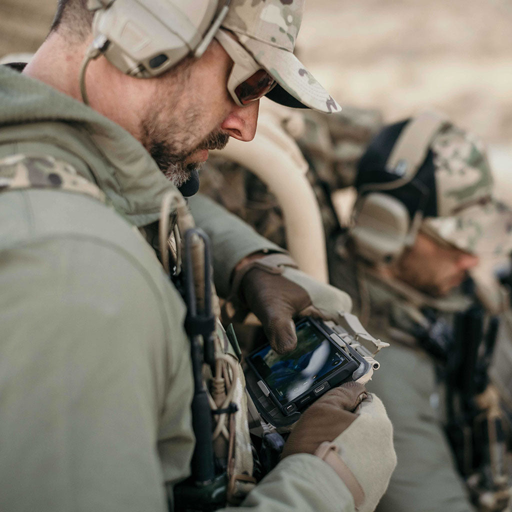 Operators accessing their smart phones inside Thyrm DarkVault 2.0 Critical Gear Cases