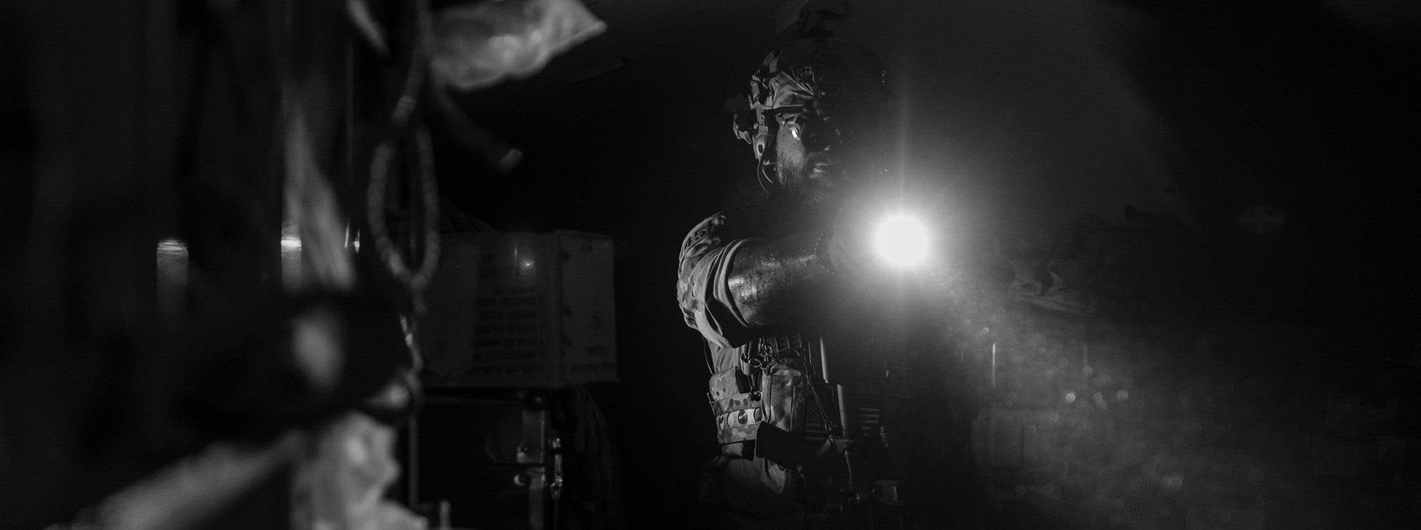 Soldier using a light in darkness
