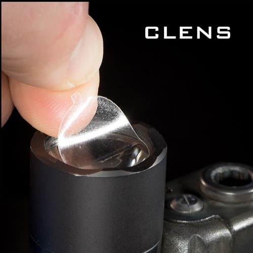 Zoom in of CLENS Lens Protector being mounted to a light by the fingers