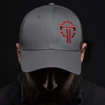 Person wearing Grey Trucker Cap with red and black embroidered Thyrm Logo