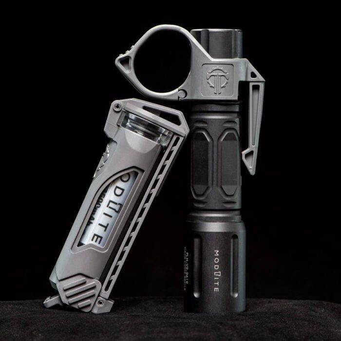 Thyrm CellVault-18 Battery Storage next to a SwitchBack Flashlight Ring, both in Urban Grey