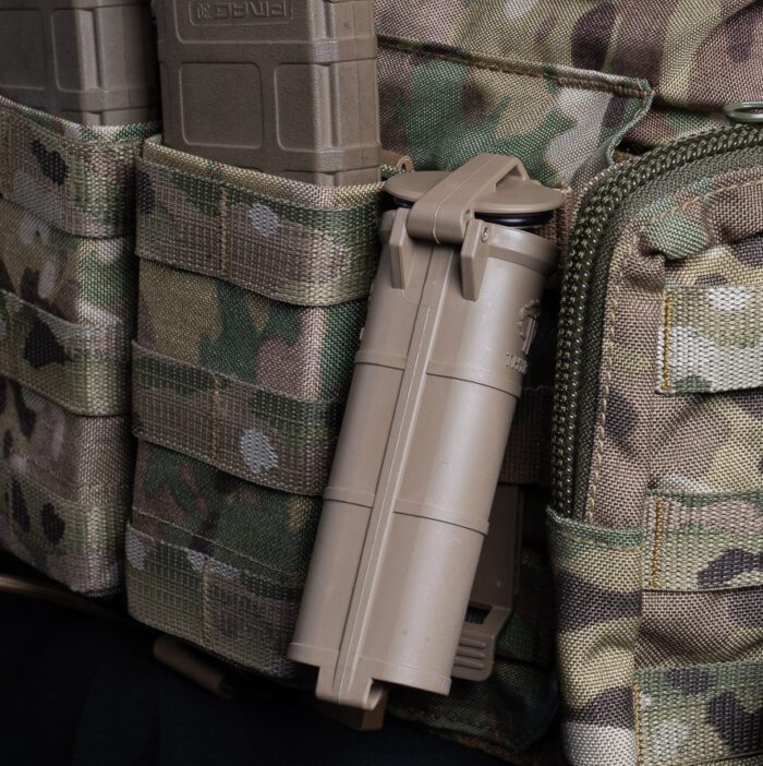 CellVault XL opening while mounted on a chest rig's MOLLE