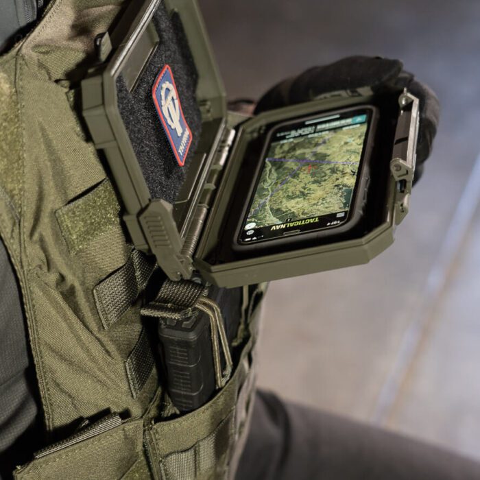 DarkVault mounted to a chest rig, serving as a Navigation Board with a cell phone inside