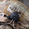 Thyrm VariArc-VS Helmet Mount mounted to a helmet, leaving room for hearing protection