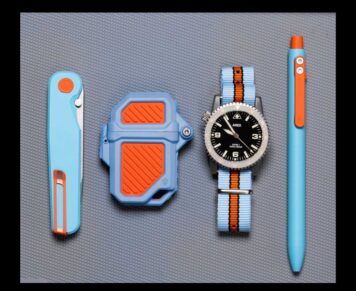EDC layout of knife, Vintage Racing PyroVault 2.0 Lighter Armor, Ares watch with matching band, and pen, all in vintage color scheme