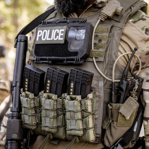 DarkVault 2.0 Critical Gear Case marked with Police Patch on vest